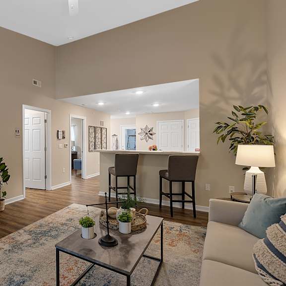 a living room with a television, a couch, and a coffee table.