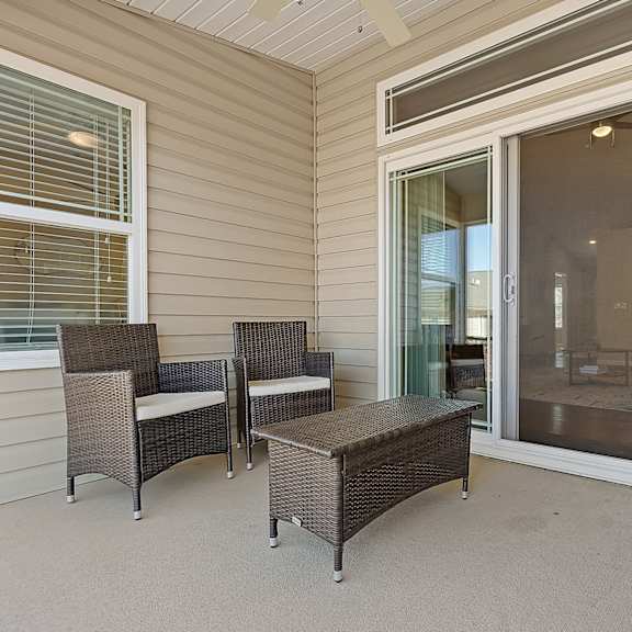 a patio with a table and chairs.