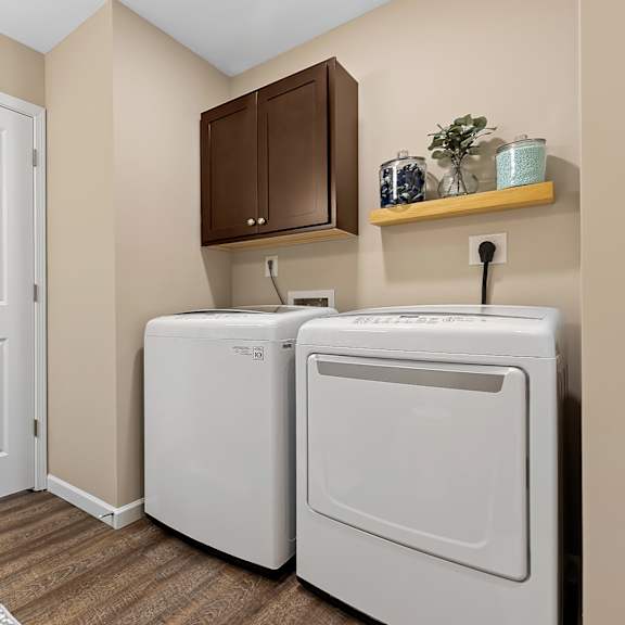 a small laundry room with a washer and dryer.