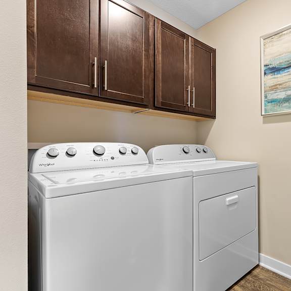 a white washer and dryer in a laundry room.