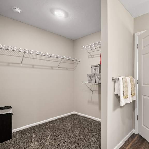 a white door is open to a bathroom.