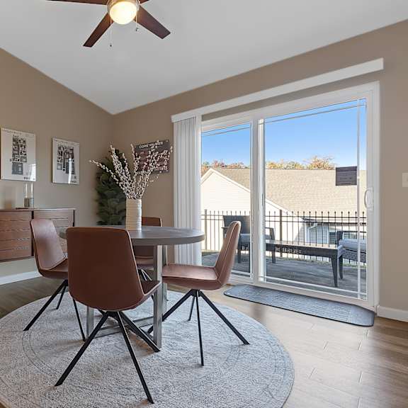 a dining room with a table and chairs.