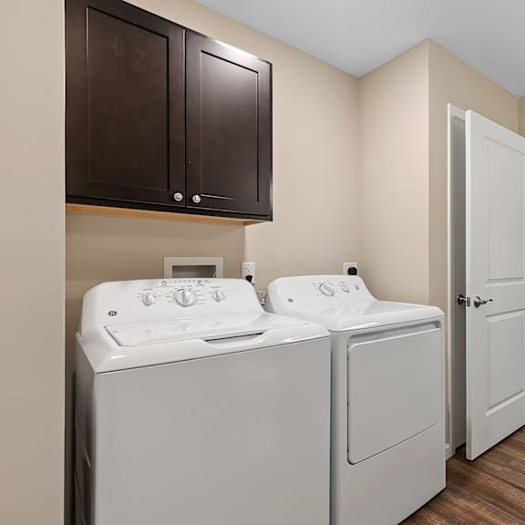 a laundry room with a washer and dryer.