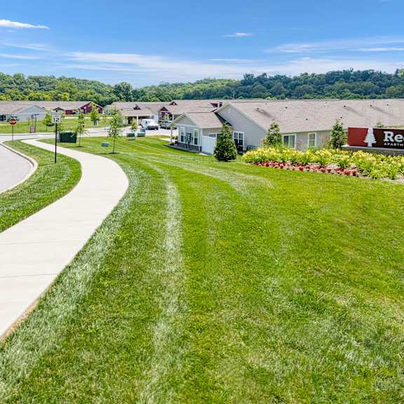 a suburban neighborhood with a sign that says redwood.