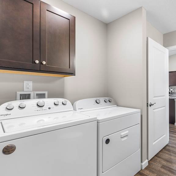 a laundry room with a washer and dryer.