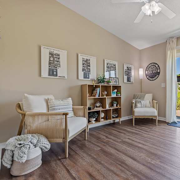 a living room with a sliding glass door leading to a patio.