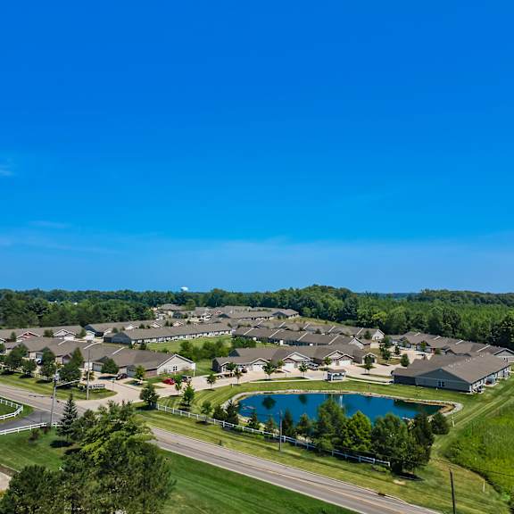 a bird's eye view of a residential area with a swimming pool.