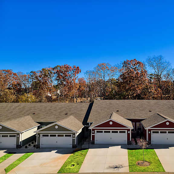 a row of houses with garages in front of them.