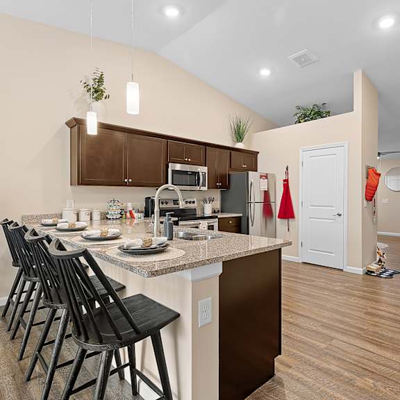 a kitchen with a table and chairs.