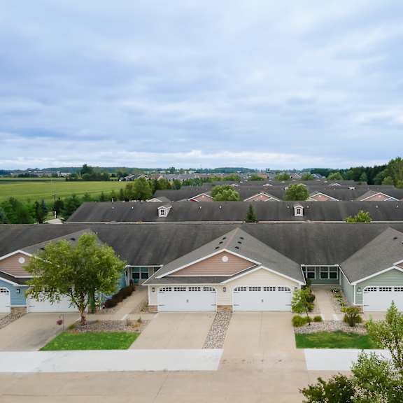 a large, well-maintained residential area with multiple houses and driveways.