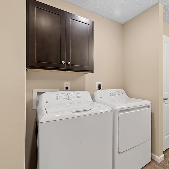 a laundry room with a washer and dryer.