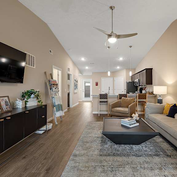 a living room with a white couch and a coffee table.