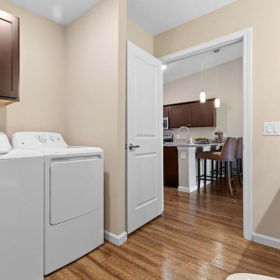 a white washer and dryer in a laundry room.