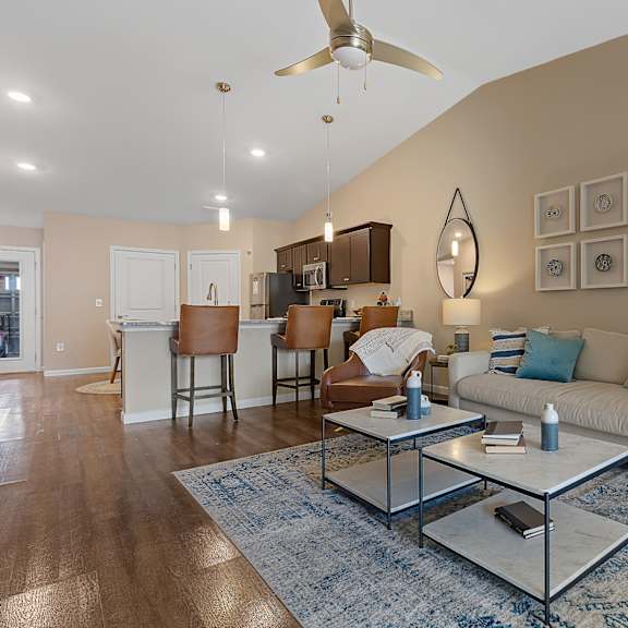 a living room with a white couch and a coffee table.