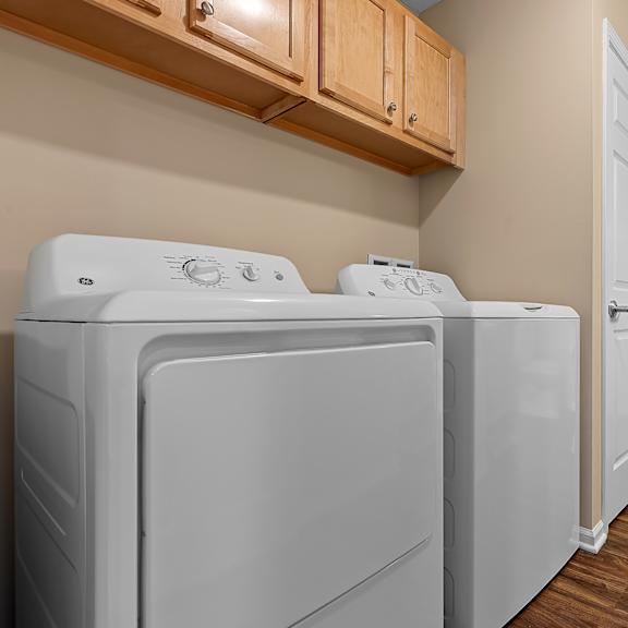 a laundry room with a washer and dryer.