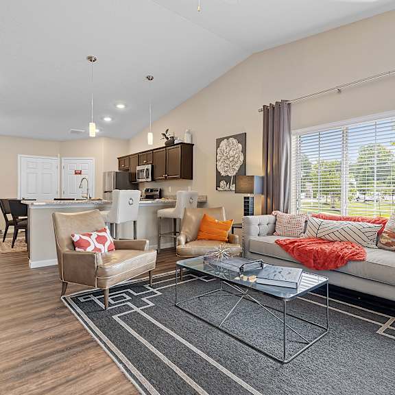 a modern living room with a white sofa and a coffee table.