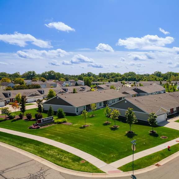 a suburban neighborhood with houses and a clear sky.