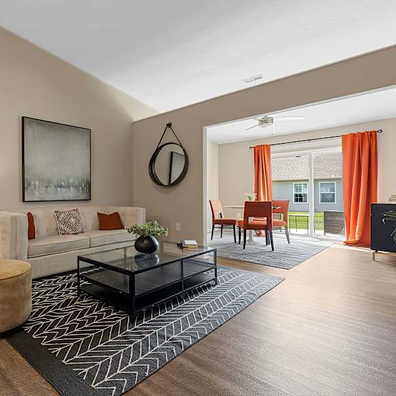 a living room with a brown chair and a black coffee table.