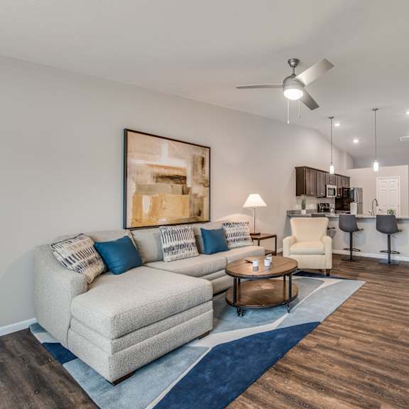 a living room with a white couch and a coffee table.