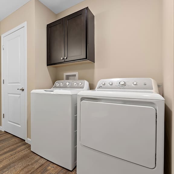 a laundry room with a washer and dryer.