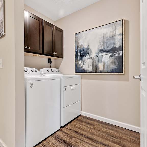 a laundry room with a washer and dryer.