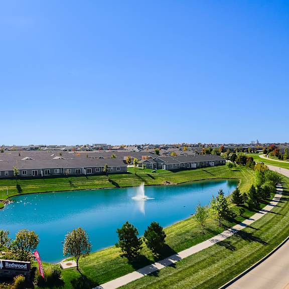 a large body of water surrounded by a housing development.