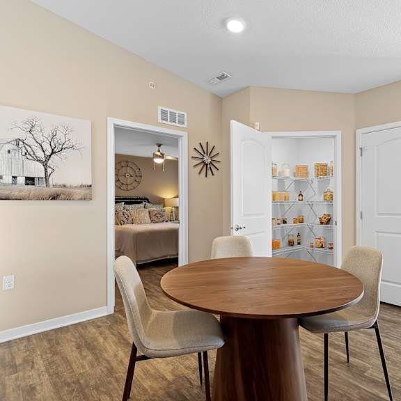 a dining room with a wooden table and chairs.