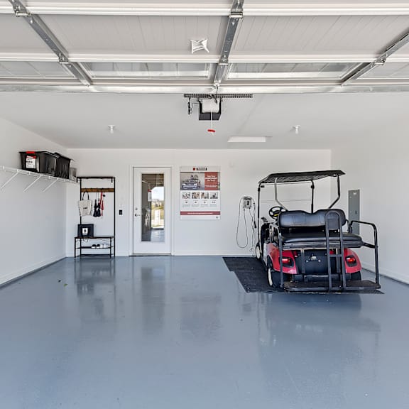 a golf cart is parked inside a garage.