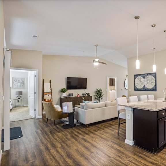 a living room with a kitchen and a dining room