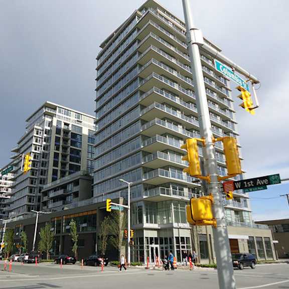 a tall building with many windows on the side of it