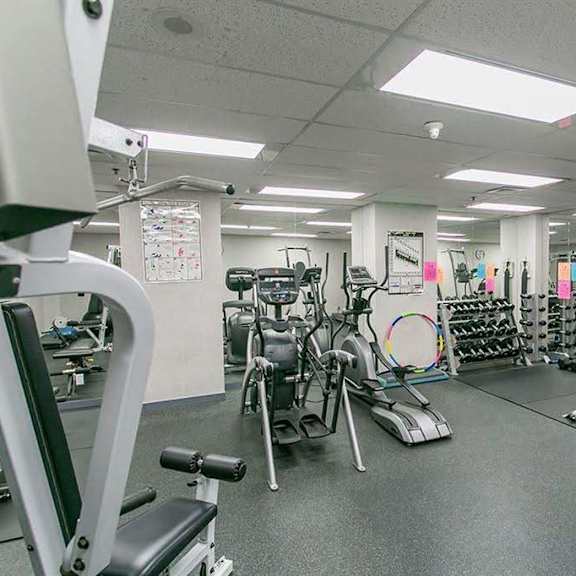 a gym with a variety of exercise equipment.