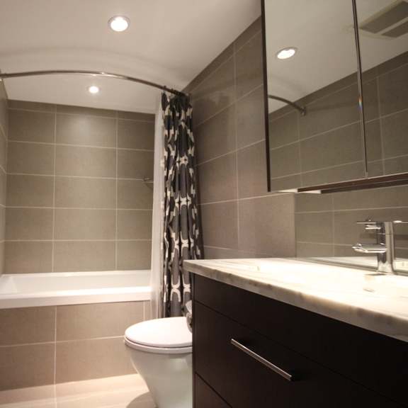 a bathroom with a toilet sink and bathtub