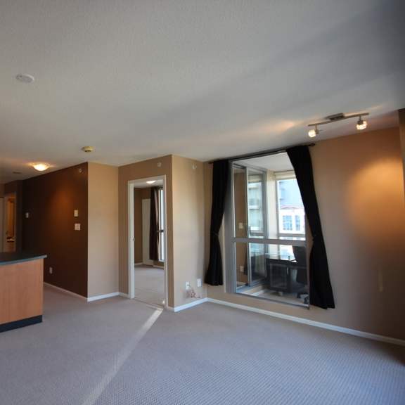 an open living room and kitchen area in an apartment