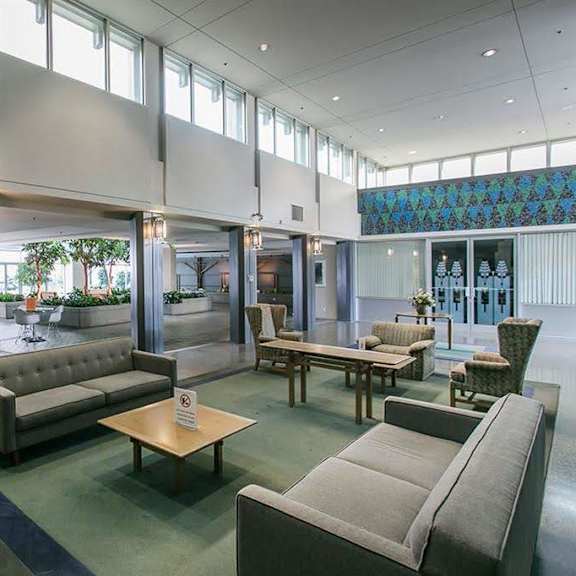 a living room with a grey sofa and a coffee table.