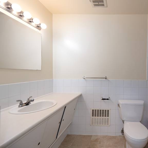 a bathroom with a toilet sink and bathtub