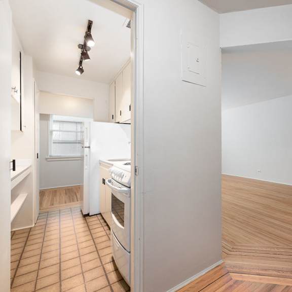 a kitchen and living room in a 555 waverly unit