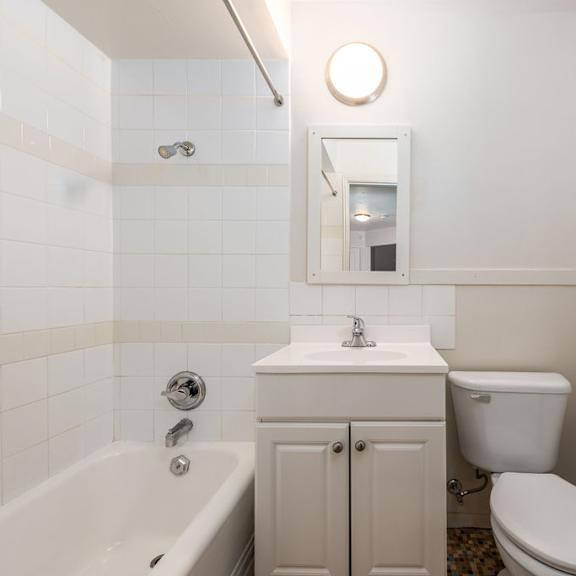 a bathroom with a sink toilet and bathtub