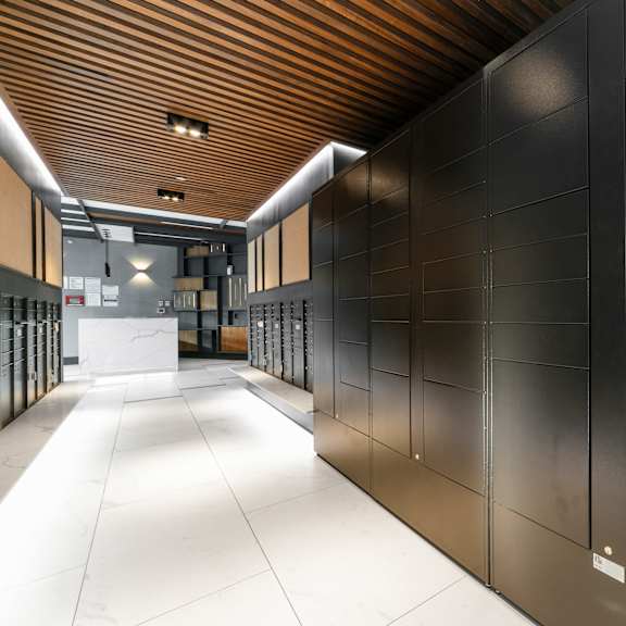 a long hallway with a sign that says package concierge.