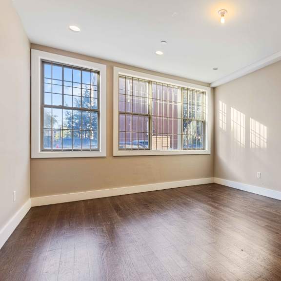 a room with a window and a railing.