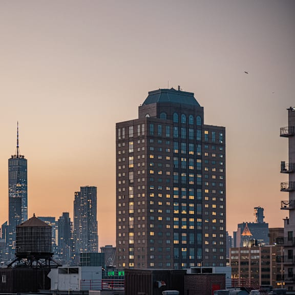 the skyline of the city at sunset