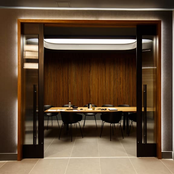 a dining room with a table and chairs