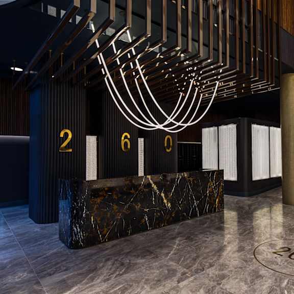 the lobby of a building with a sculpture of aorah on the ceiling