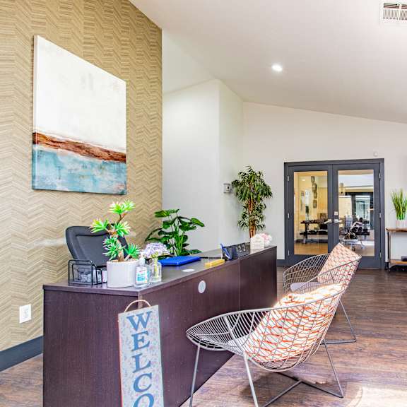 a living room with a desk and chairs at metro 3610, california