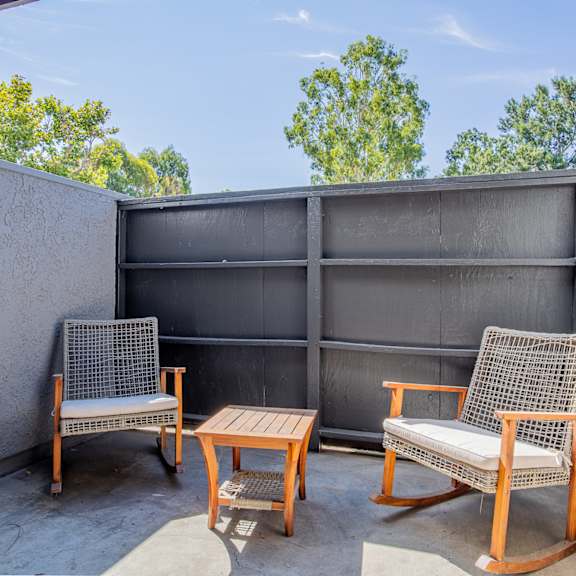 patio with two chairs and coffee table at banbury apartments riverside