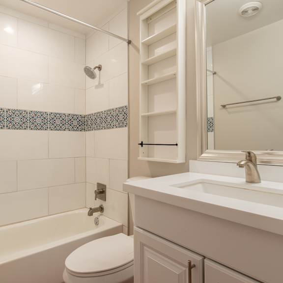 a bathroom with a sink toilet and bathtub