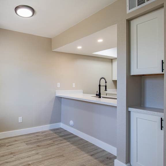 a kitchen with a sink and a window