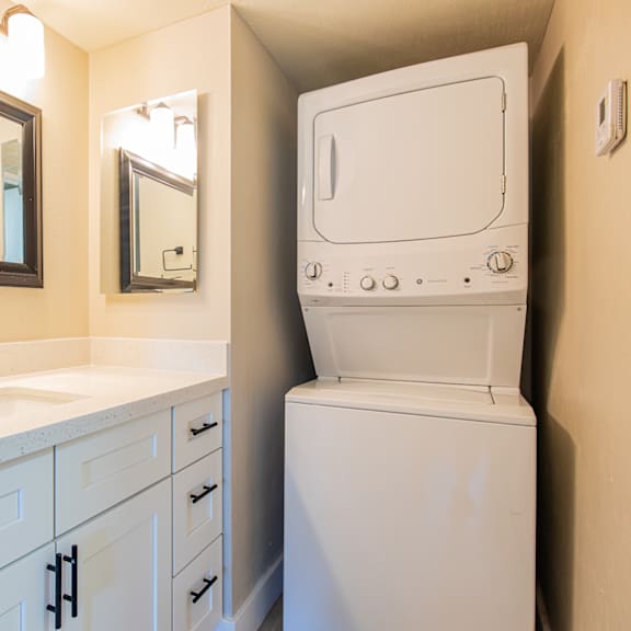 a bathroom with a washer and dryer