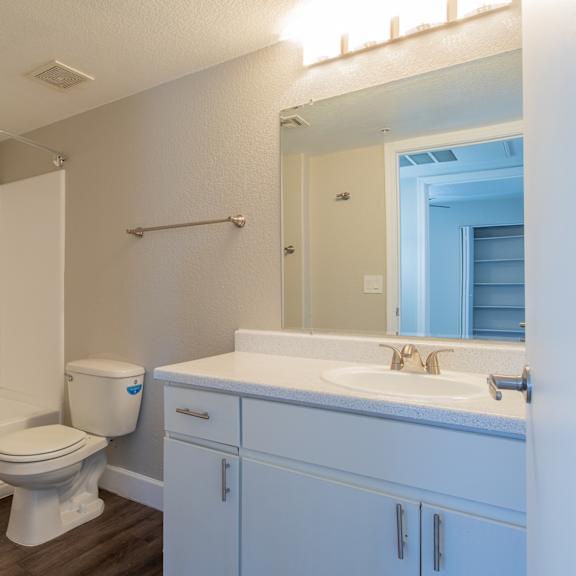 a bathroom with a toilet sink and bathtub