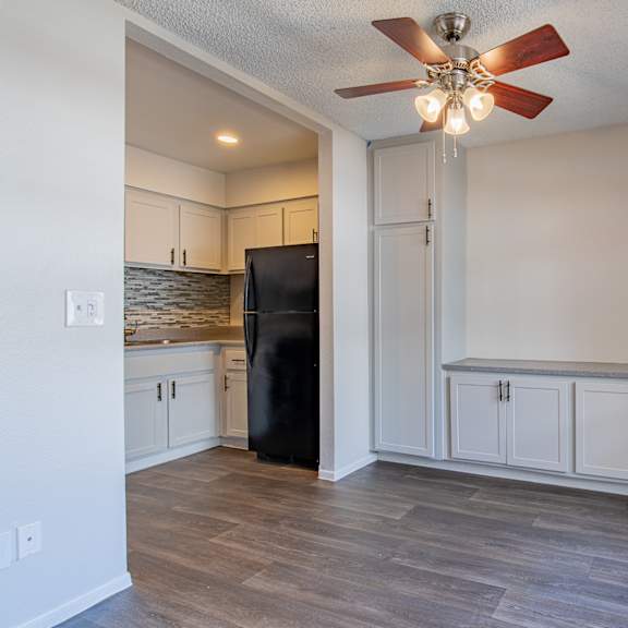 a kitchen and living room with a ceiling fan at sofia apartments, tempe, az at sofia apartments, tempe, 85283