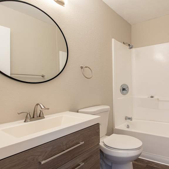 a bathroom with a toilet sink and bathtub